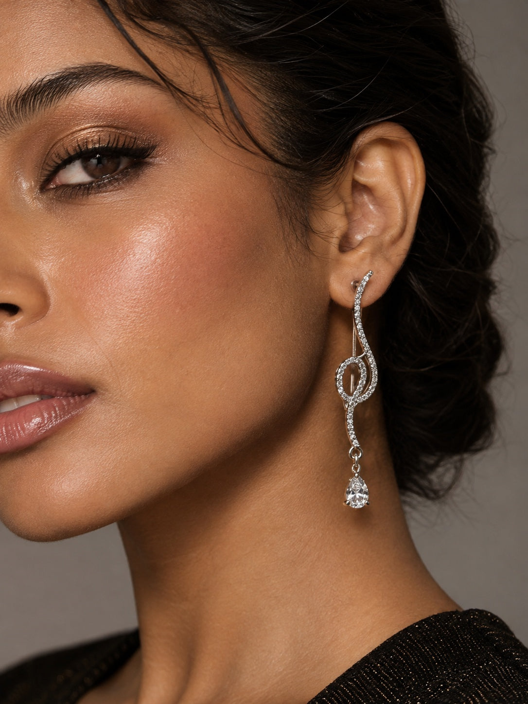 NISKA silver crystal loop drop earrings worn by model, close-up