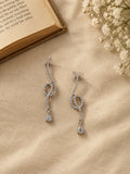 NISKA silver crystal loop drop earrings editorial flat lay
