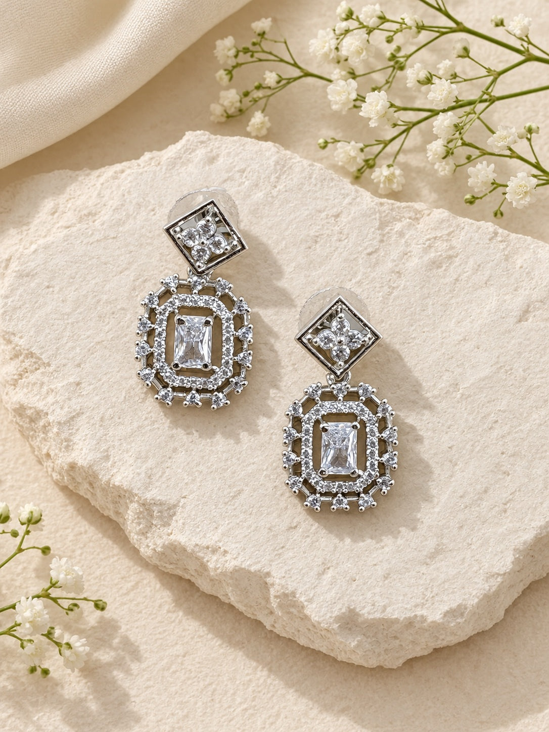 Silver AD stone replica drop earrings worn by model