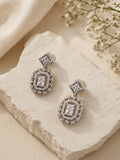 Silver AD stone replica drop earrings close-up flat lay
