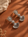 Close-up view of NISKA silver replica earrings