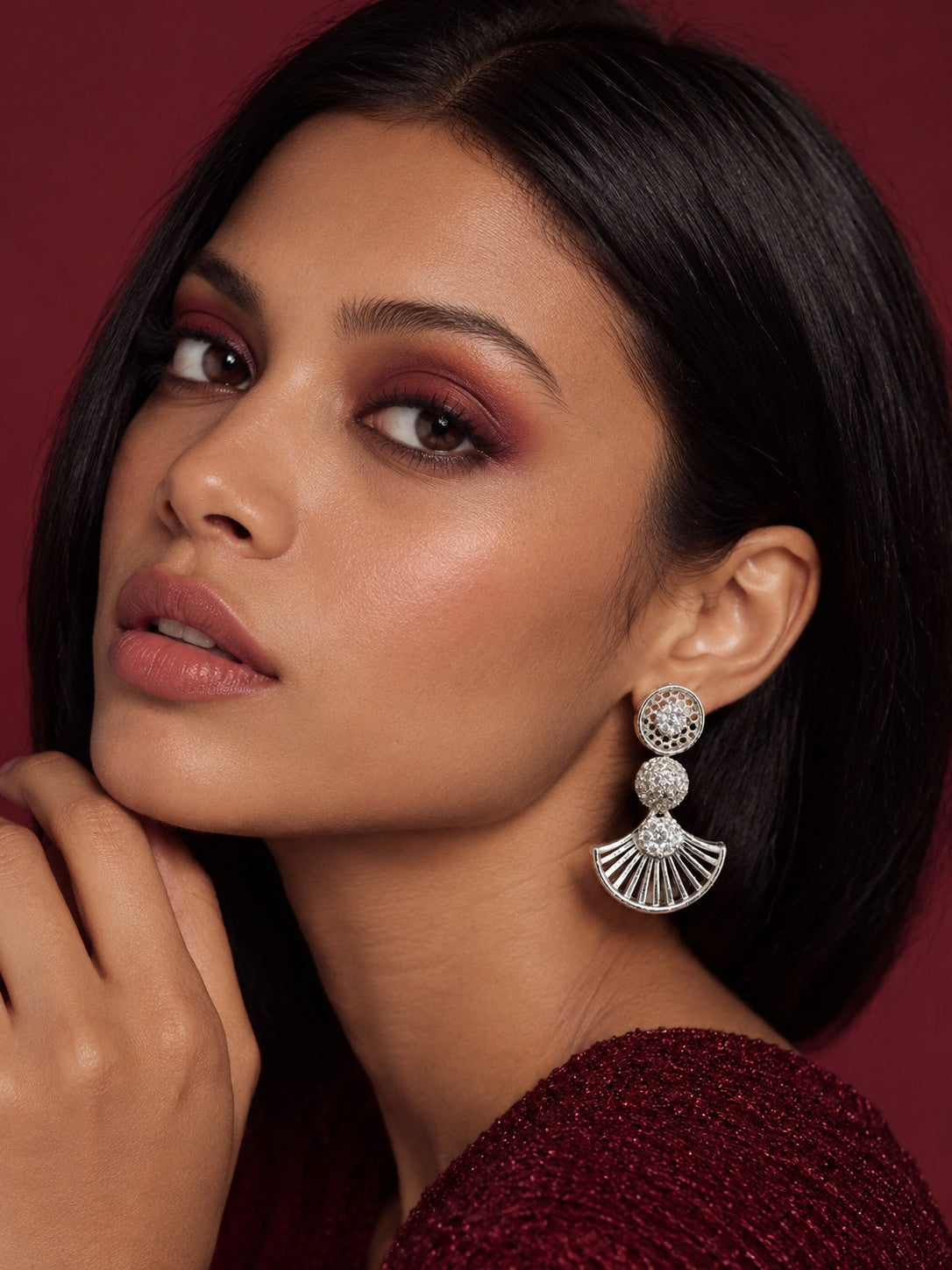 Model wearing NISKA AD Stone silver replica fan drop earrings