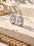 Niska AD Stone Silver Replica pear stud earrings on white travertine, view 4