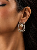 Niska silver replica pearl earrings worn on model, close-up