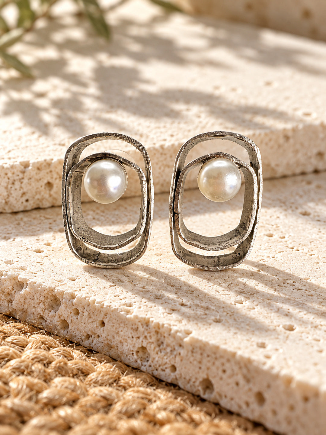 Niska silver replica pearl earrings worn on model, close-up