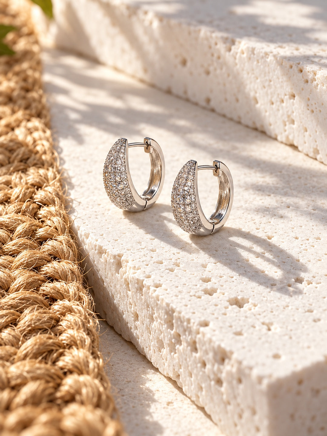 Niska AD Stone Silver Replica Hoop Earrings on white travertine 2