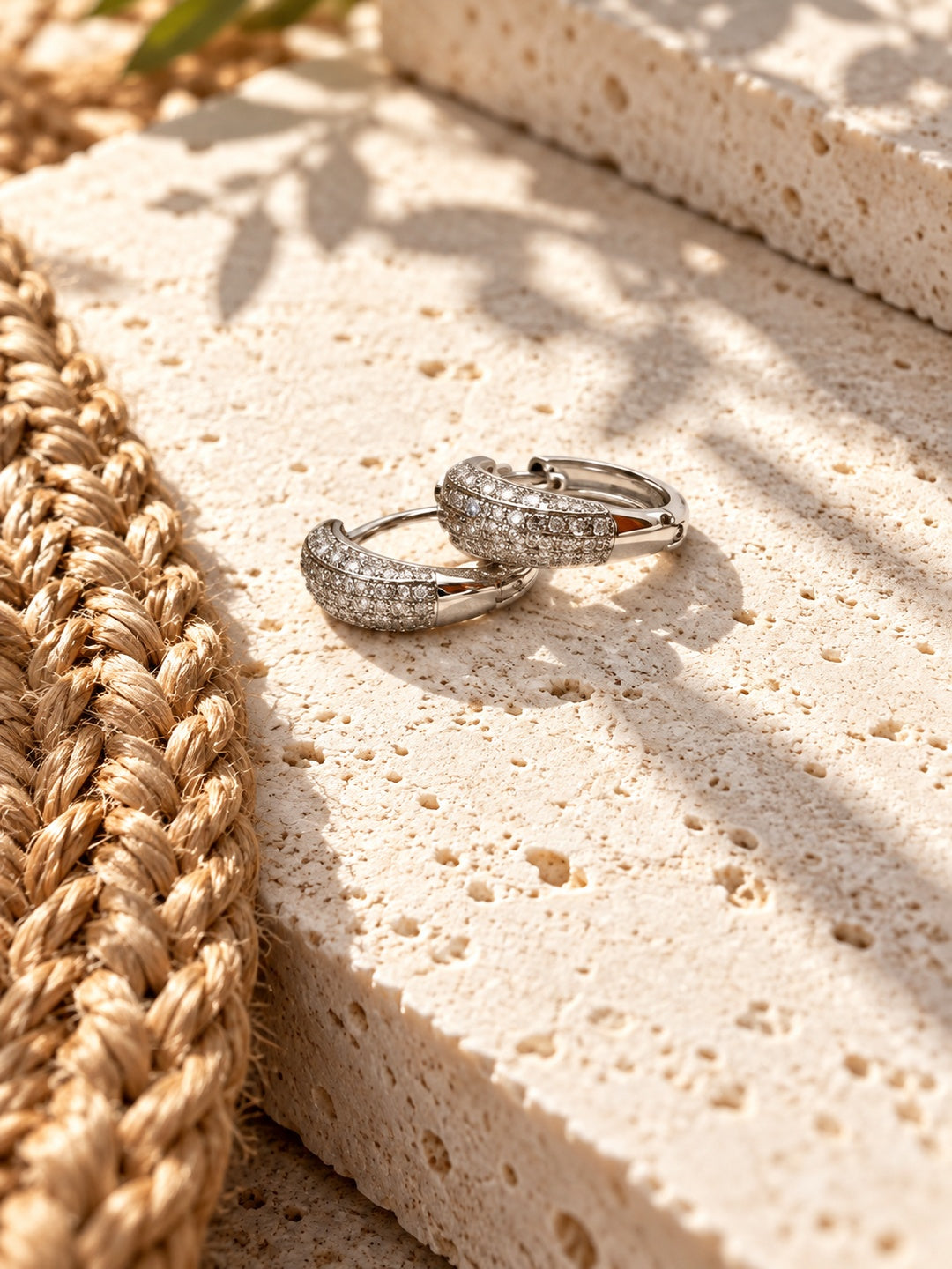 Niska AD Stone Silver Replica Hoop Earrings on white travertine 5