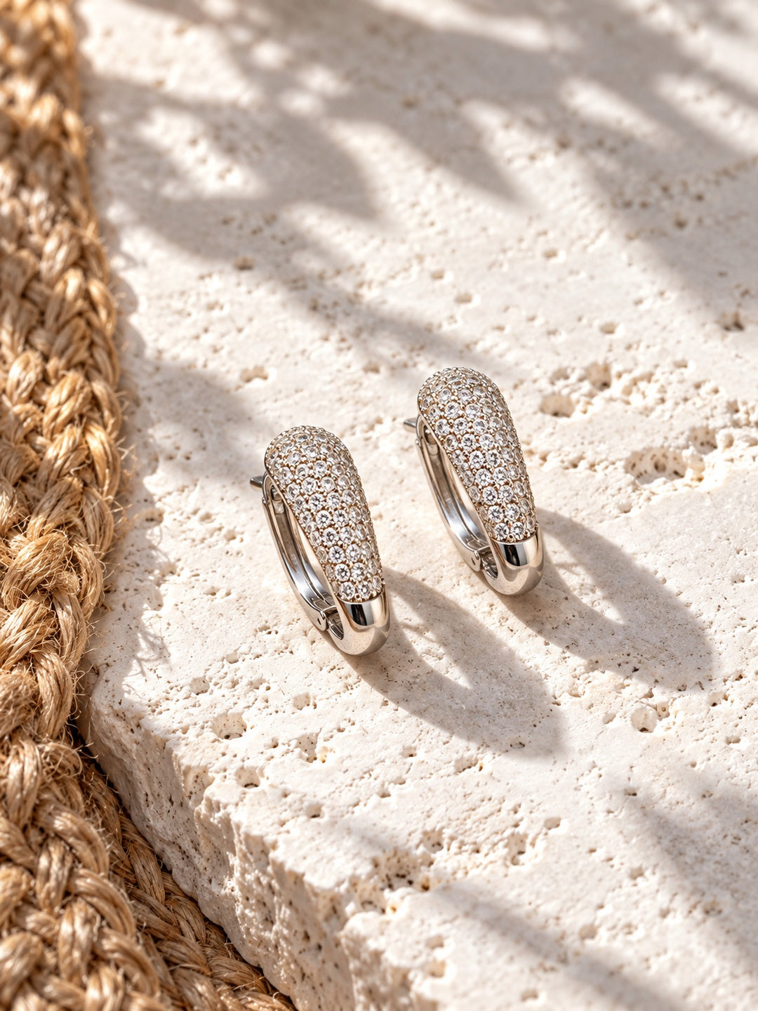 Niska AD Stone Silver Replica Hoop Earrings on white travertine 6
