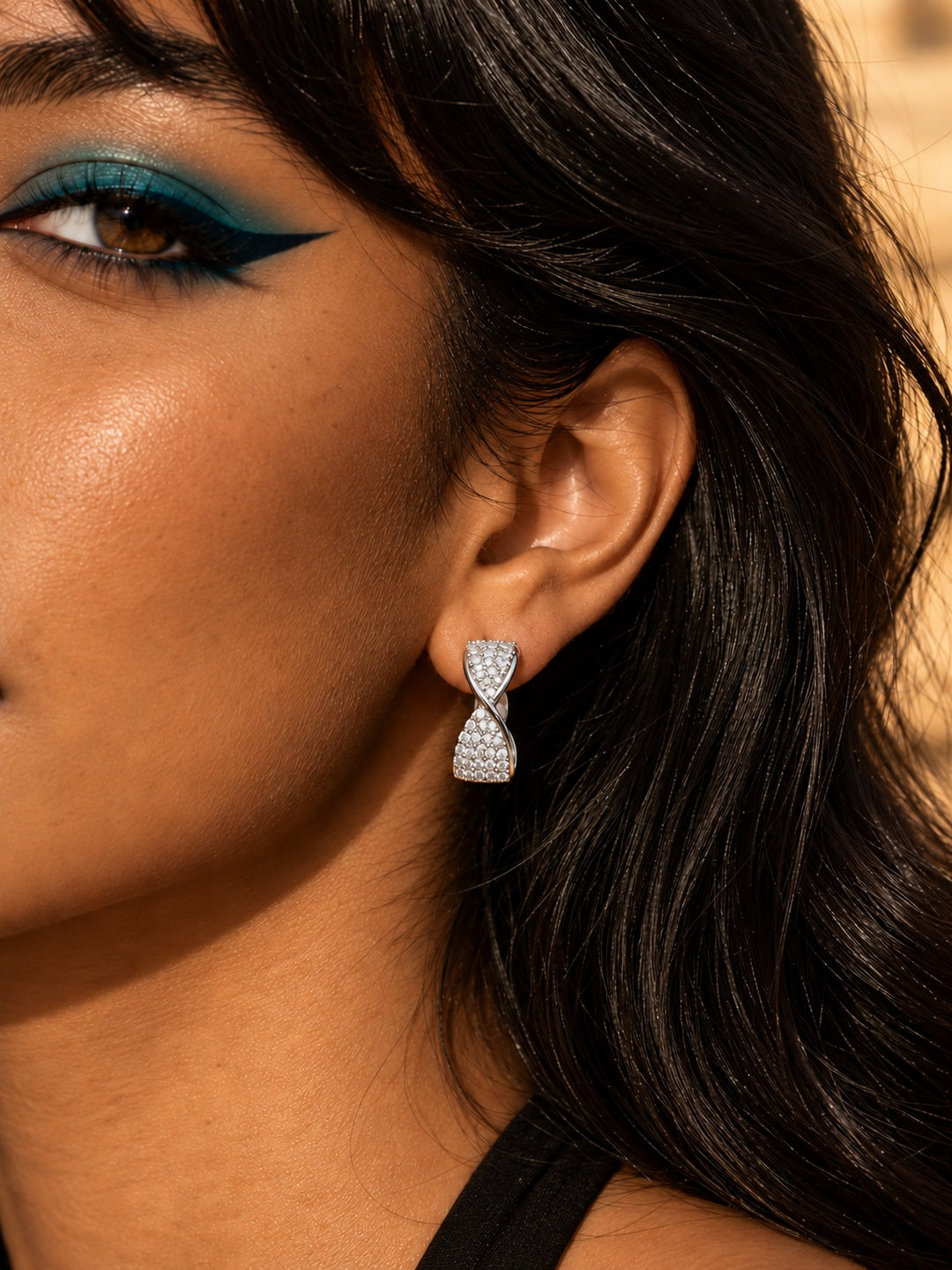 Niska AD Stone Silver Replica crossover hoop earring worn on model