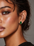 Niska green oval AD Stone Silver replica stud earring worn by model