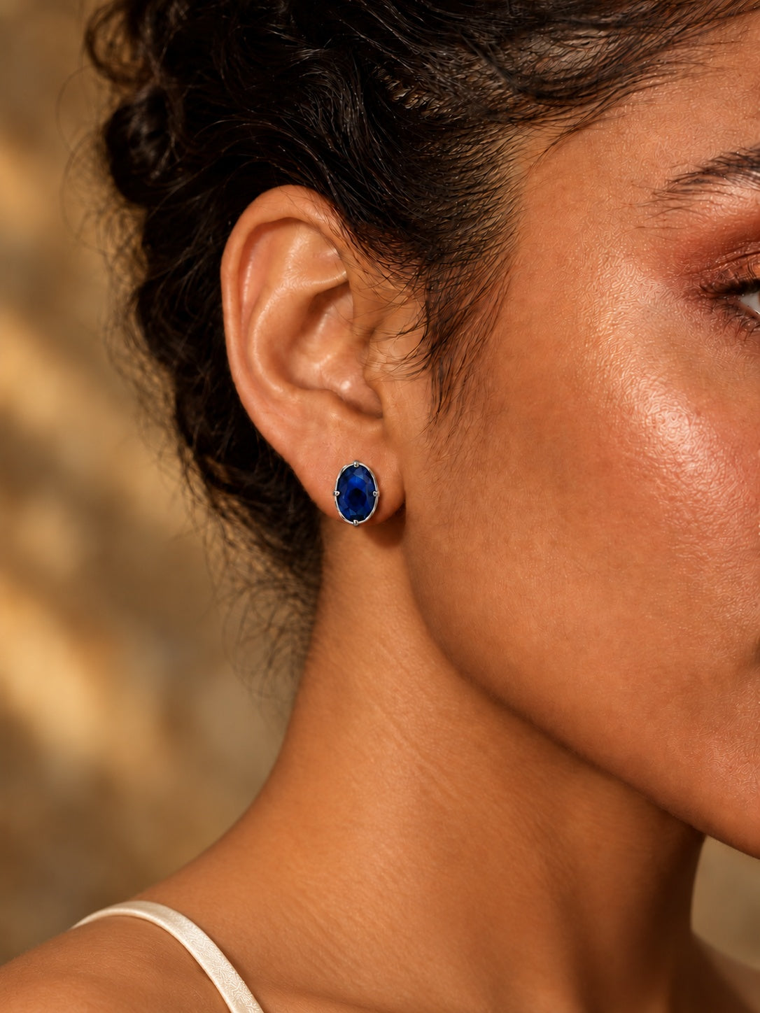 Niska navy blue oval AD Stone Silver Replica stud earring on model