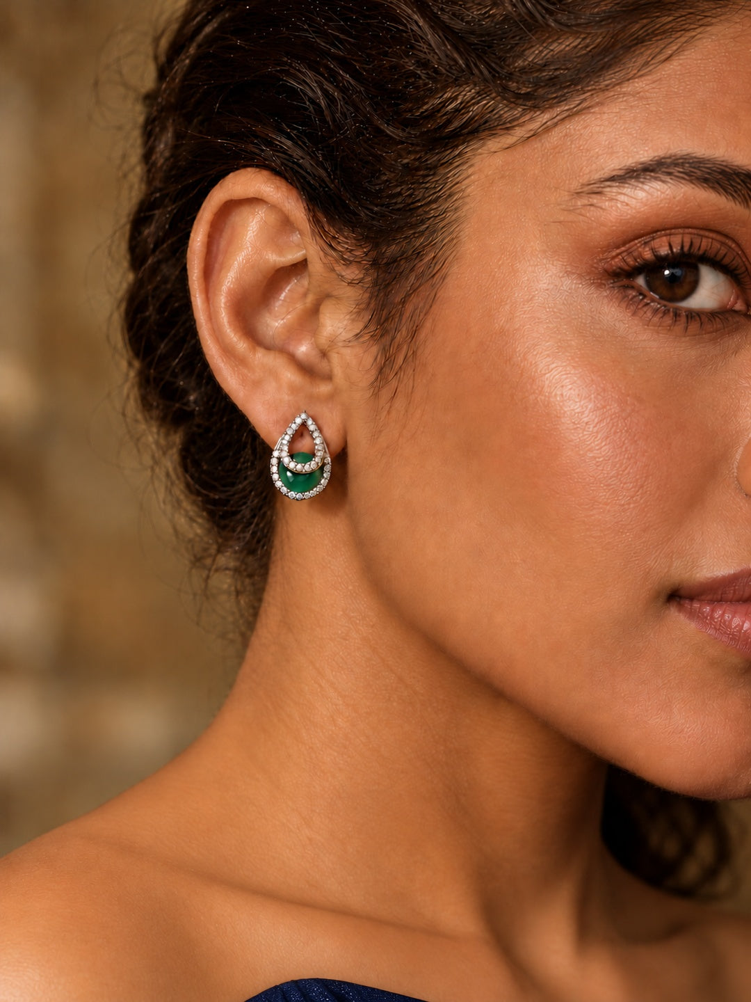 Niska green teardrop AD Stone Silver Replica earrings worn by a model