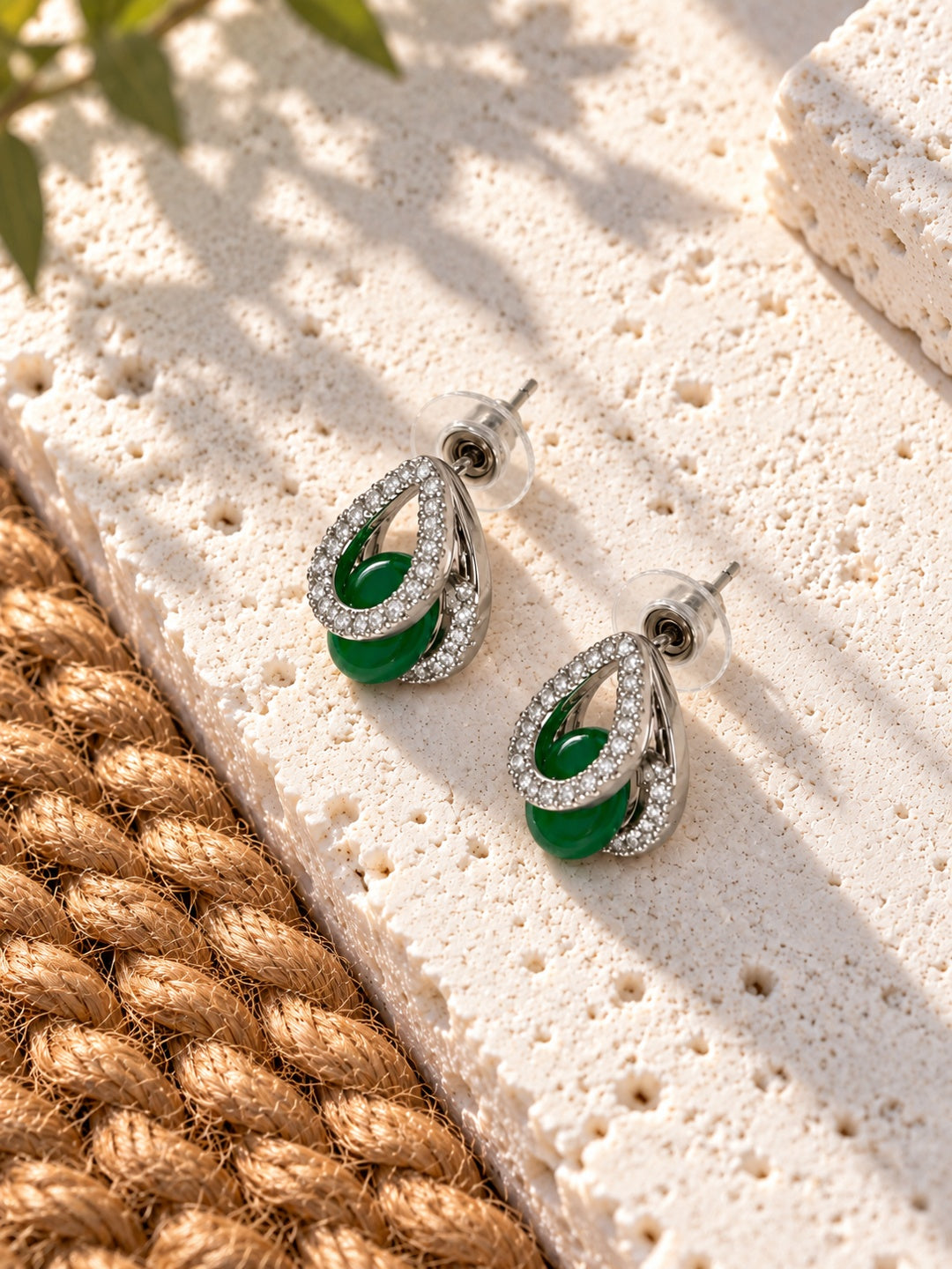 Niska green teardrop AD Stone Silver Replica earrings worn by a model