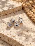 Niska blue AD Stone Silver replica earrings on travertine - view 1
