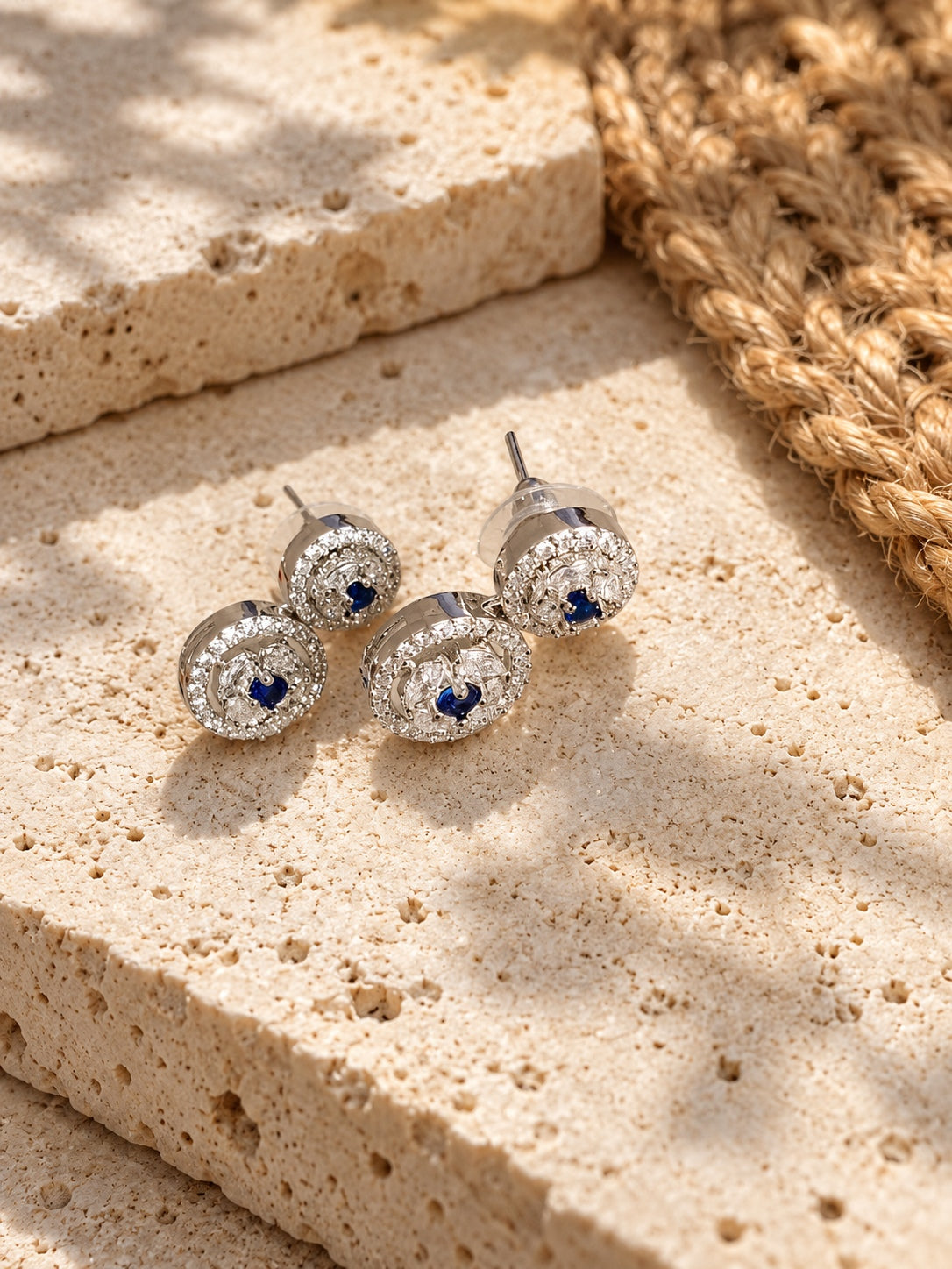 Niska blue AD Stone Silver replica earrings on travertine - view 1