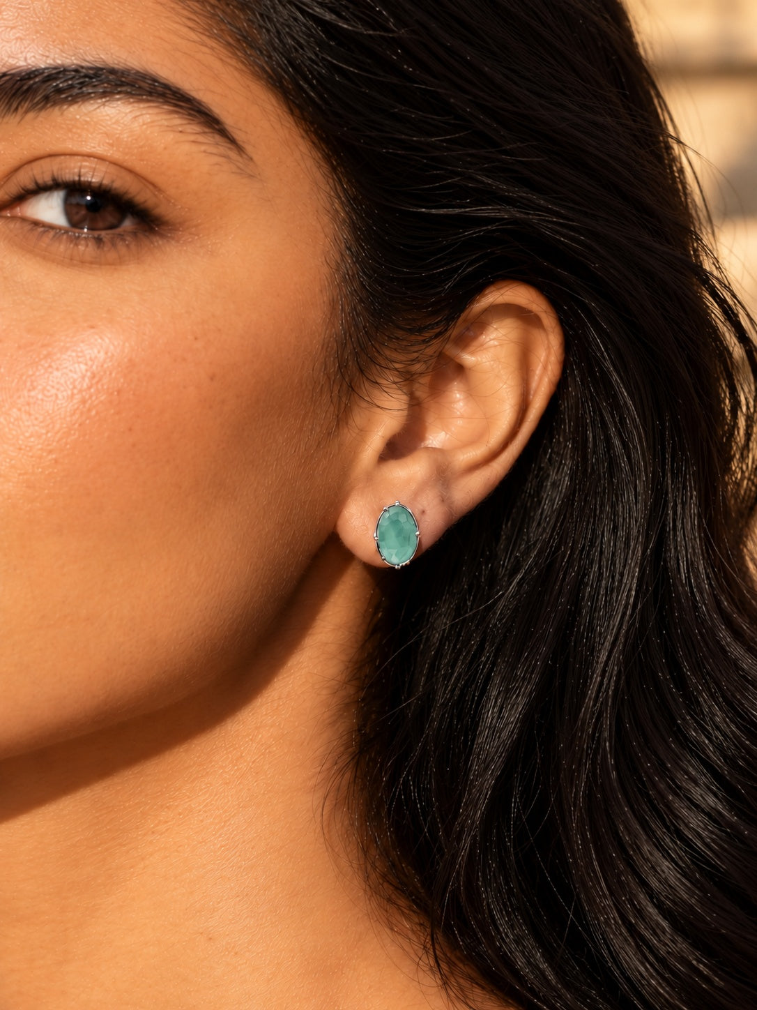 Niska sea green oval AD Stone Silver Replica stud earring worn by model