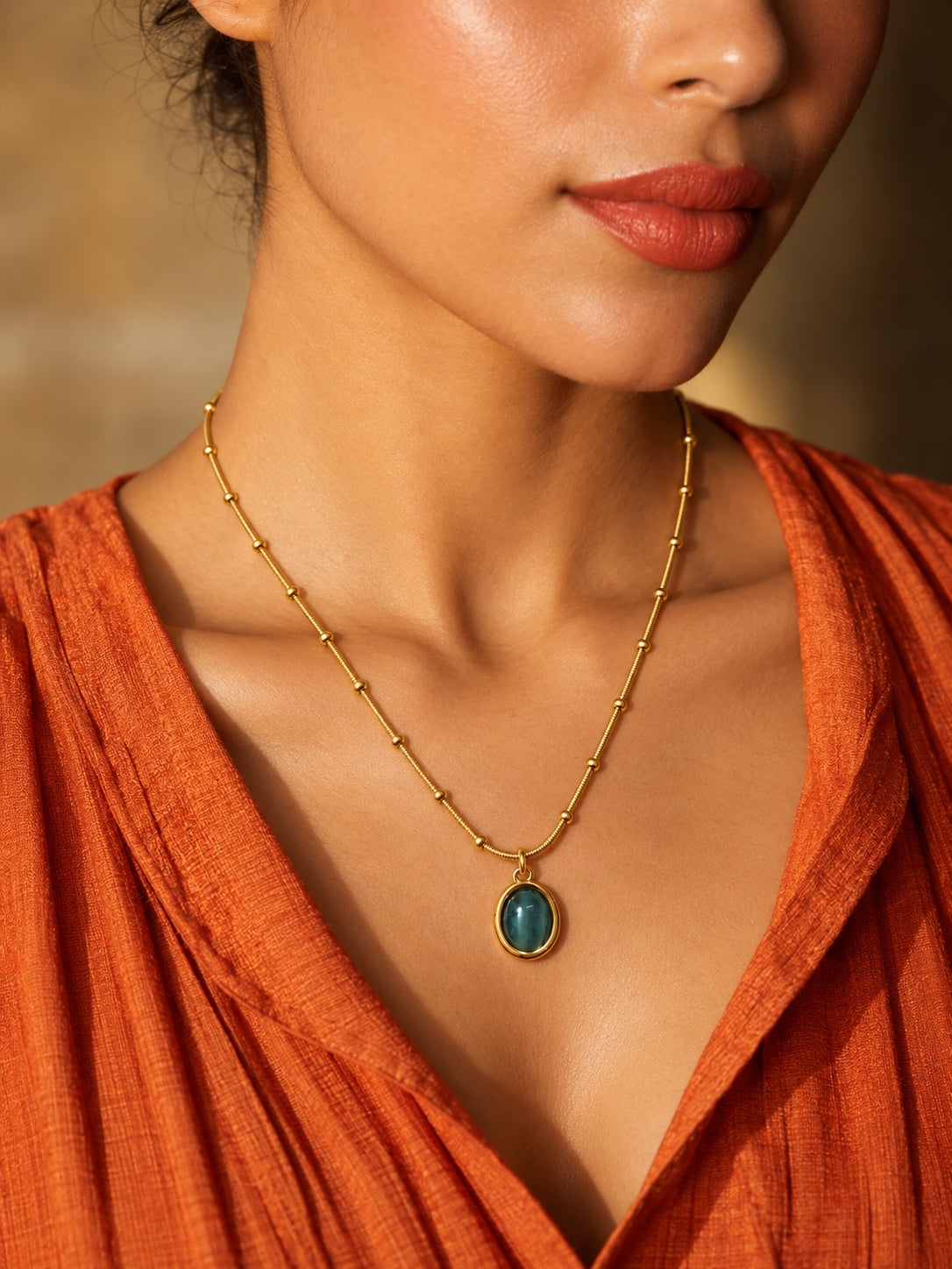 Niska green oval pendant necklace worn by model
