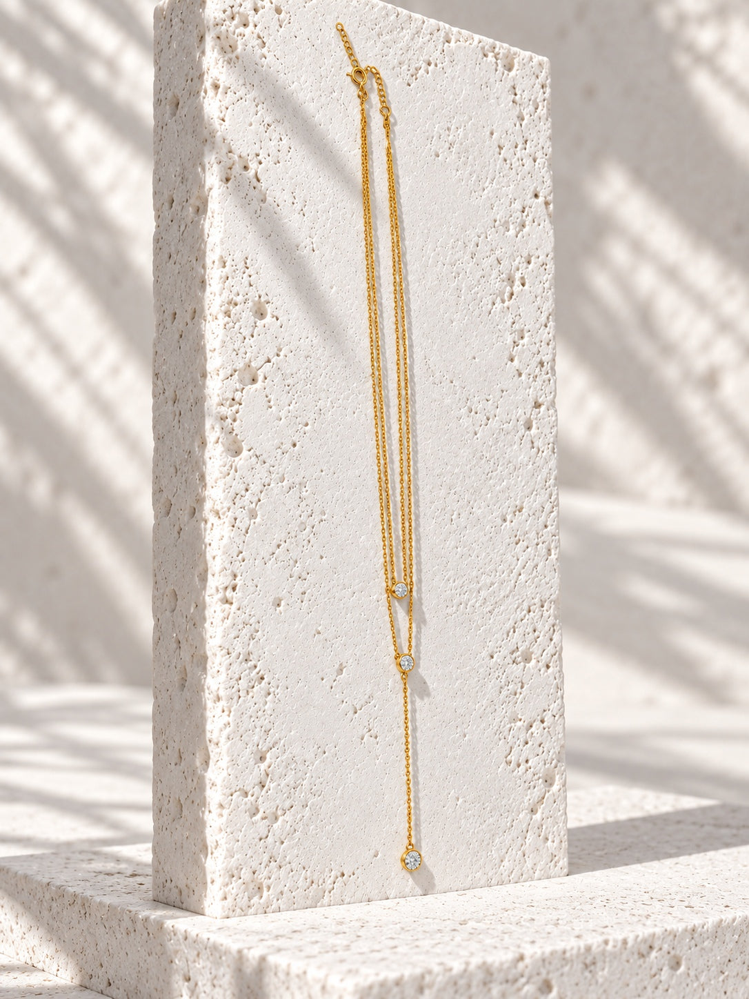Niska gold-tone layered lariat replica necklace detail view