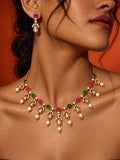 Pink and green replica necklace set with pearl drops and matching earrings — model close-up