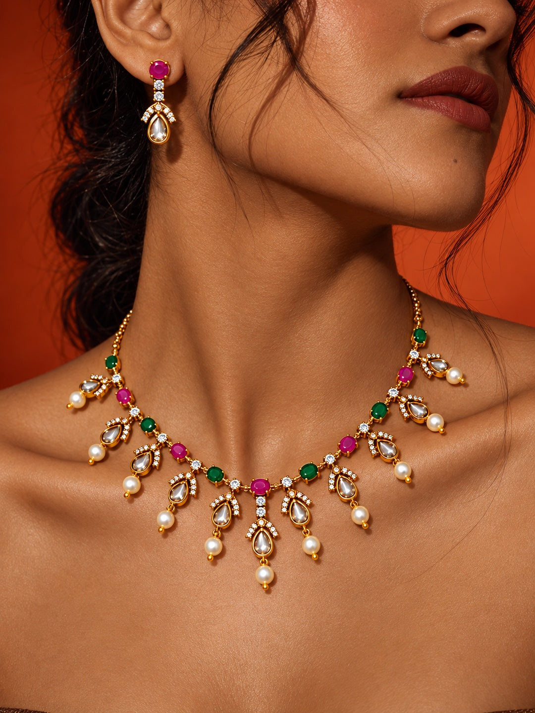 Pink and green replica necklace set with pearl drops and matching earrings — model close-up