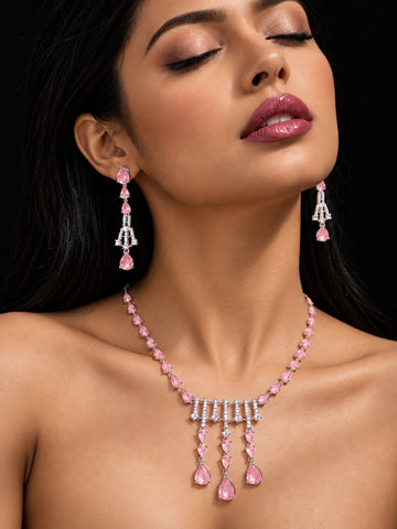 Niska blush pink silver replica necklace set with matching earrings on model