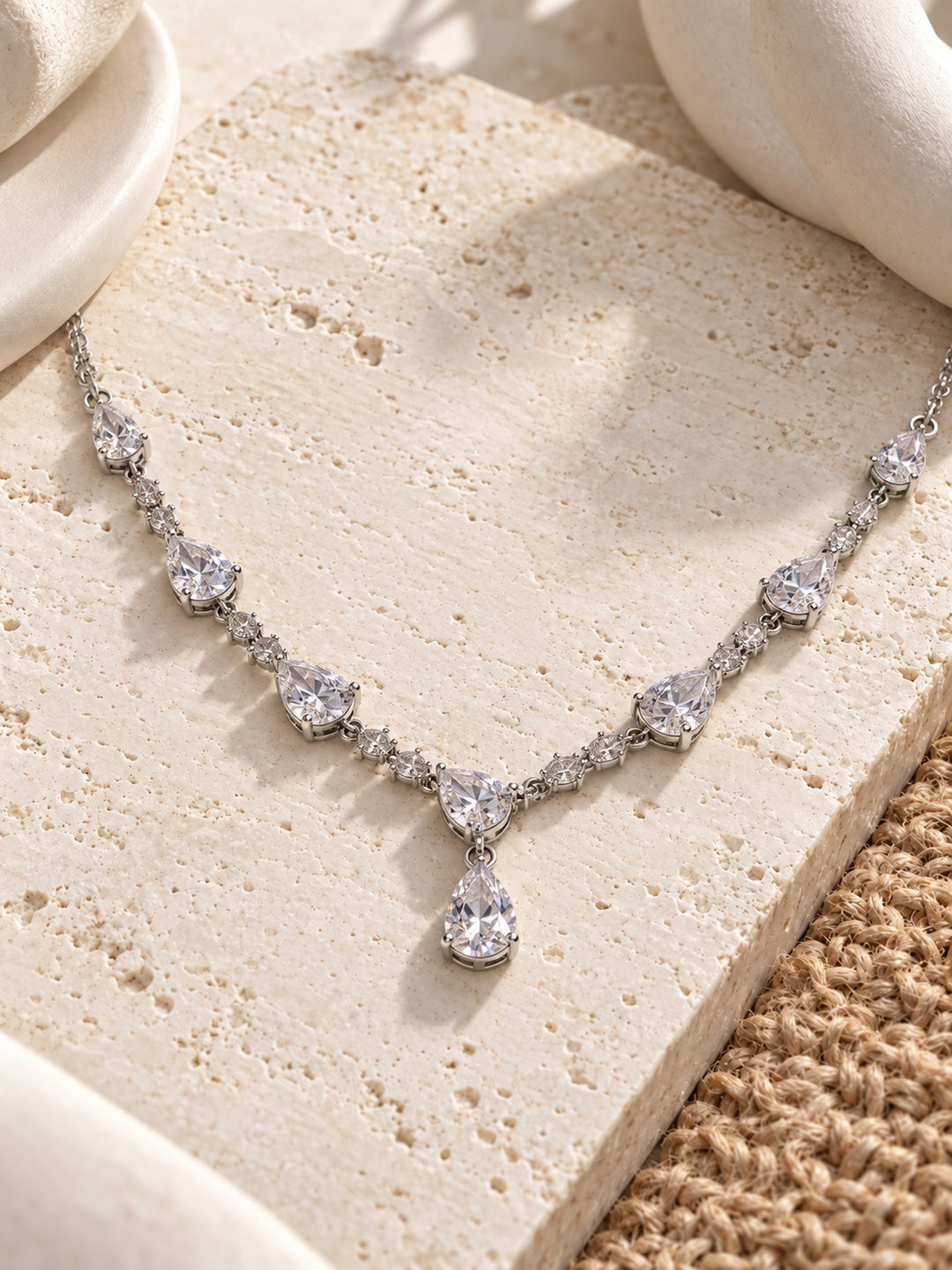 Niska pear drop replica necklace pendant detail on ivory stone