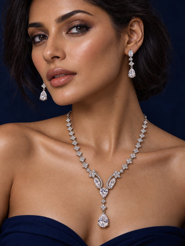 Niska pear-drop silver-tone replica necklace and earring set on model