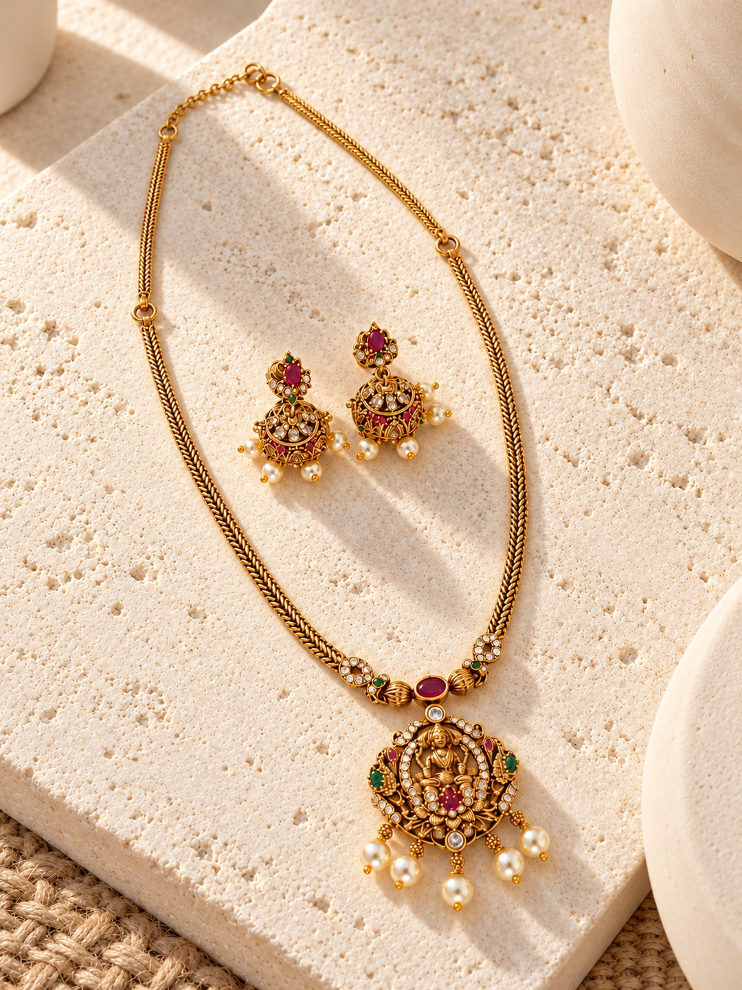 Niska gold-tone temple replica necklace set with jhumka earrings on model