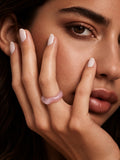 Blush pink sculpted replica ring worn on model hand