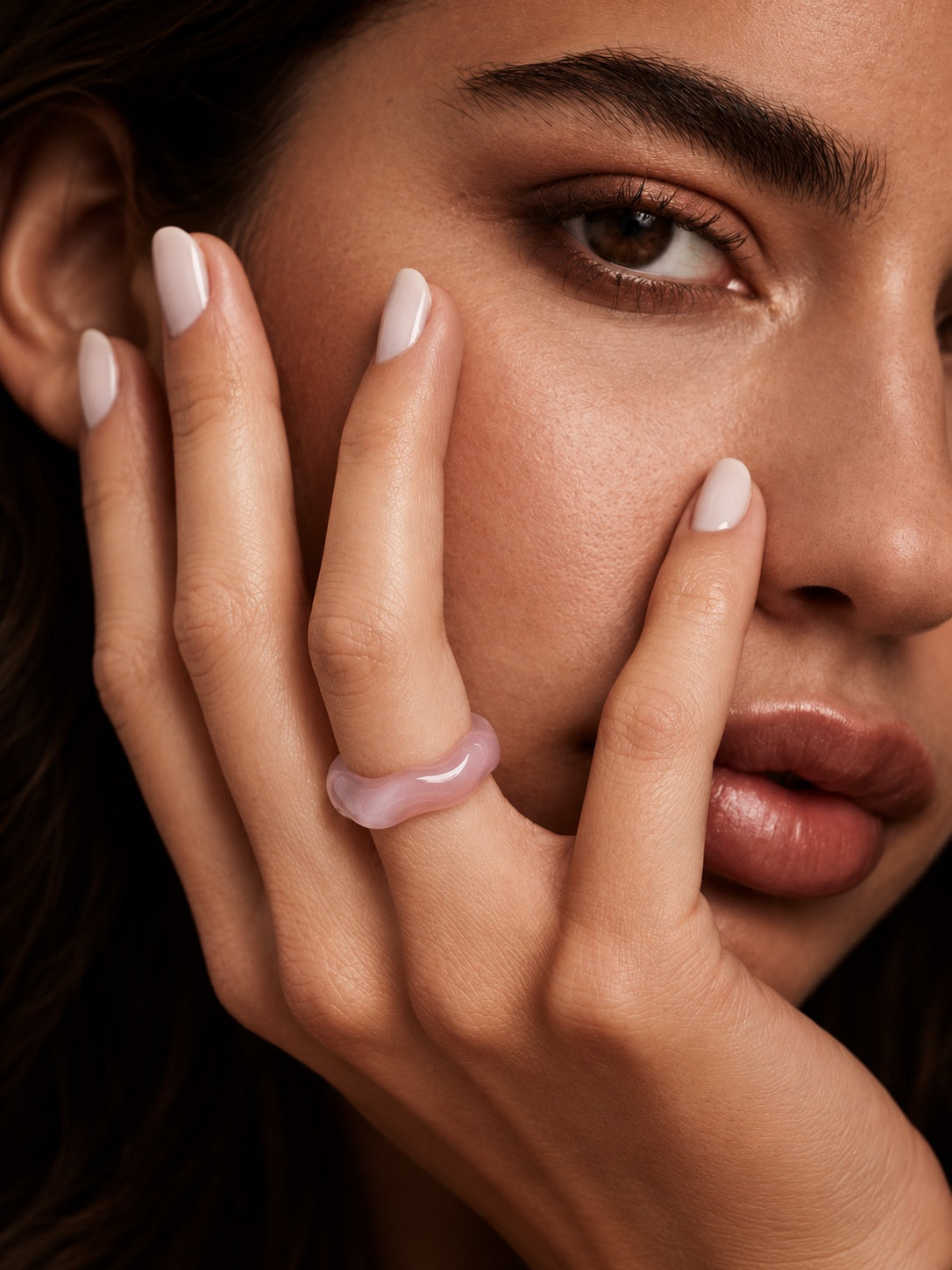 Blush pink sculpted replica ring worn on model hand