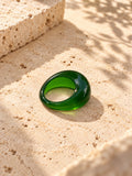 Niska green dome replica statement ring on ivory travertine, view 1
