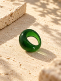 Niska green dome replica statement ring on ivory travertine, view 2