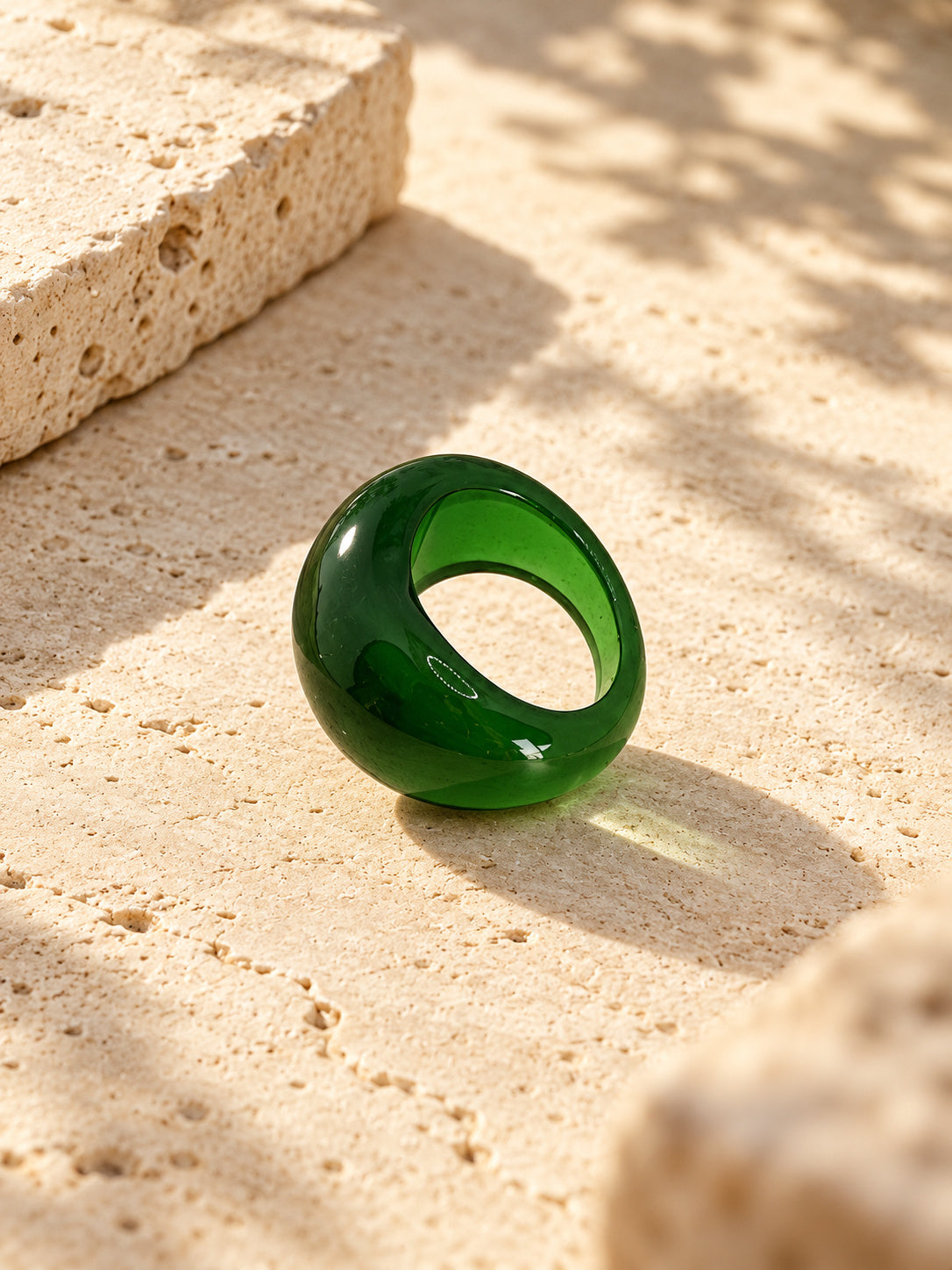 Niska green dome replica statement ring on ivory travertine, view 2