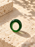 Niska green dome replica statement ring on ivory travertine, view 3