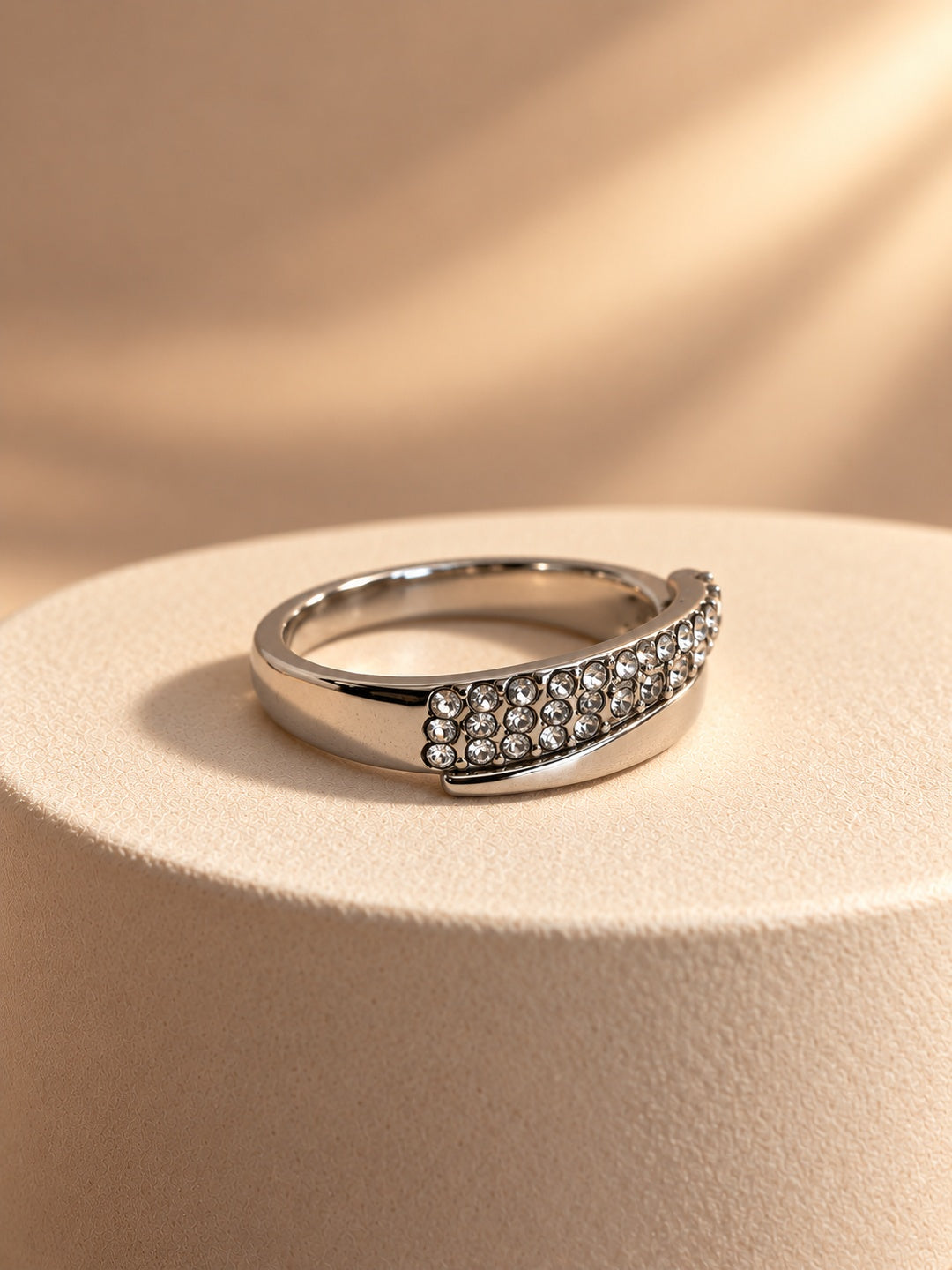 Niska silver-tone curved stone replica ring worn on model hand