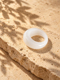 Milky White Dome Replica Ring on beige stone view 2
