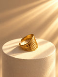Niska Golden Wave Ribbed Statement Ring – gold-tone layered ring detail