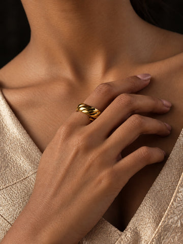 Niska sculpted gold-tone replica ring worn on hand – featured image