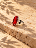 Niska red oval stone replica statement ring in a silver-tone setting