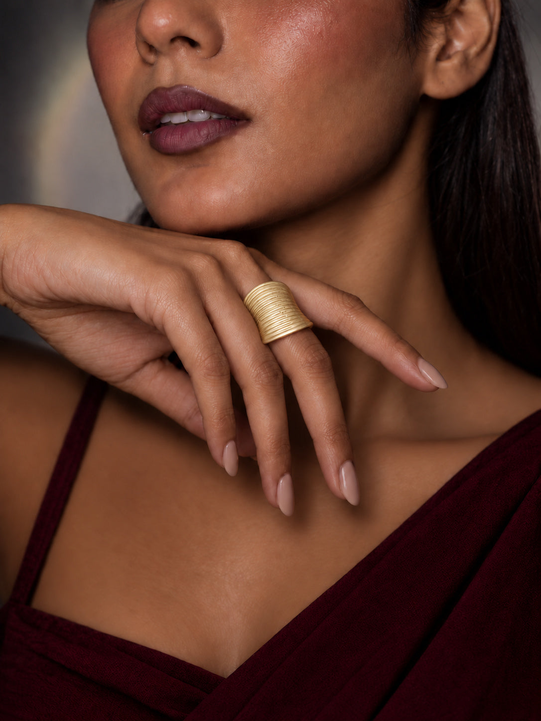 Niska gold-tone ridged statement replica ring worn on model