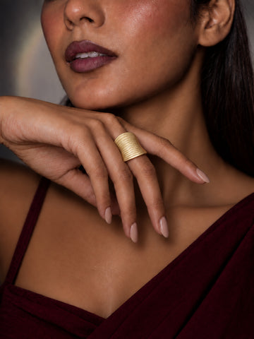 Niska gold-tone ridged statement replica ring worn on model