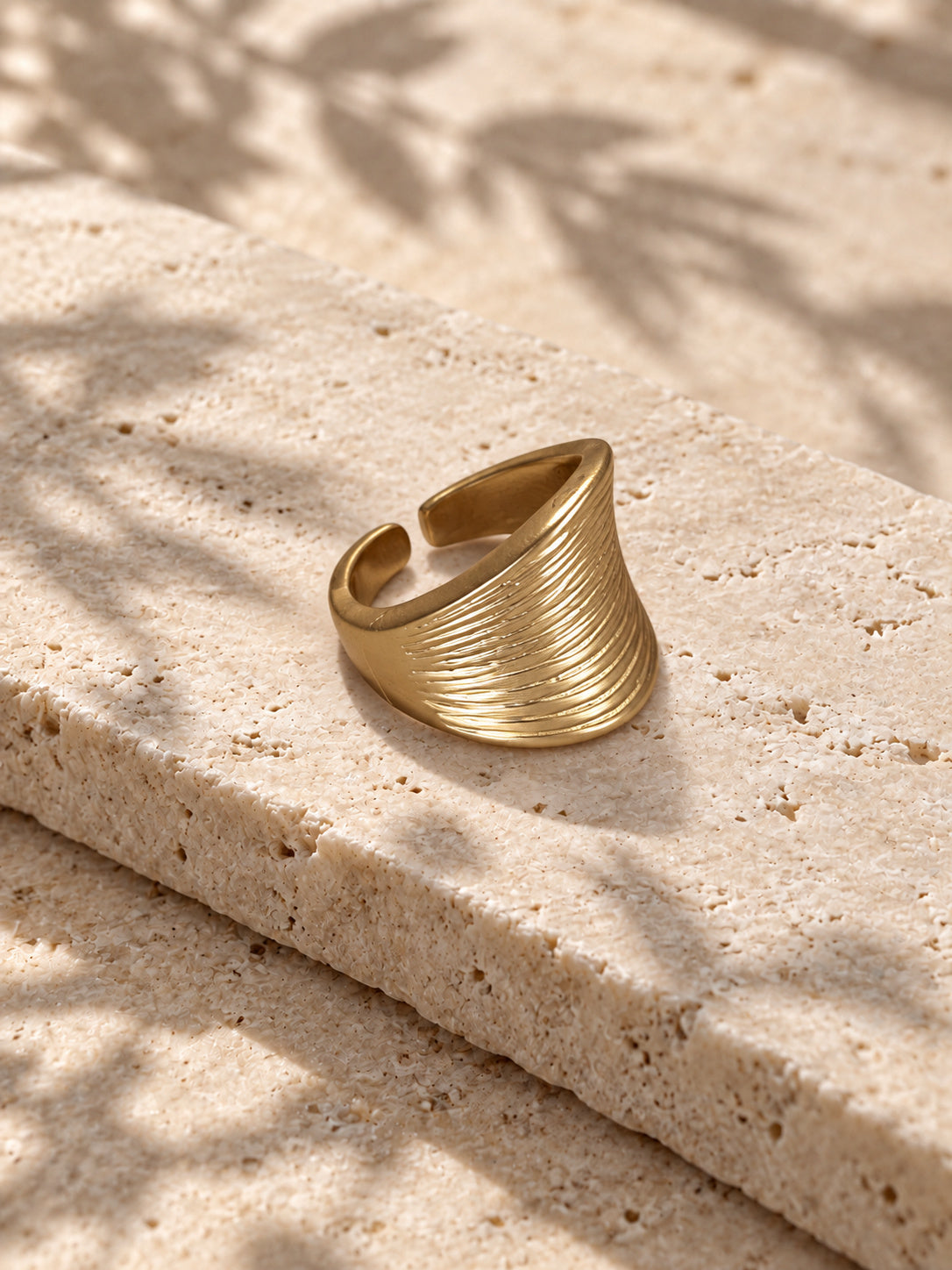 Niska gold-tone ridged statement replica ring worn on model
