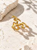Niska sculptural gold ring close-up on stone