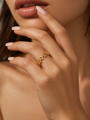 Niska Celestial Star Gold-Tone Replica Ring worn on a model's hand