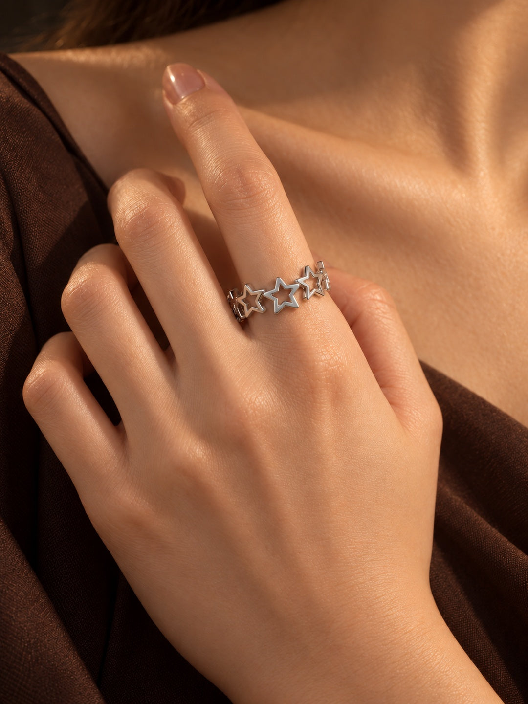 Niska silver-tone open star replica ring without stones worn on model