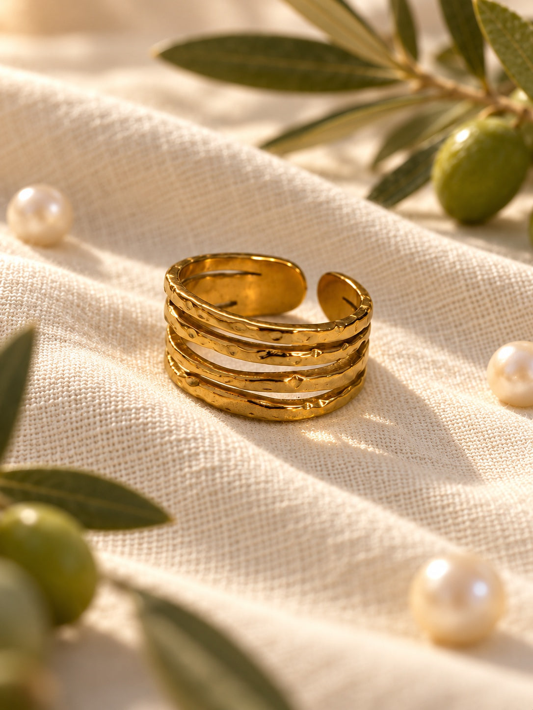 Niska hammered gold-tone four-band adjustable cuff ring worn on model's hand