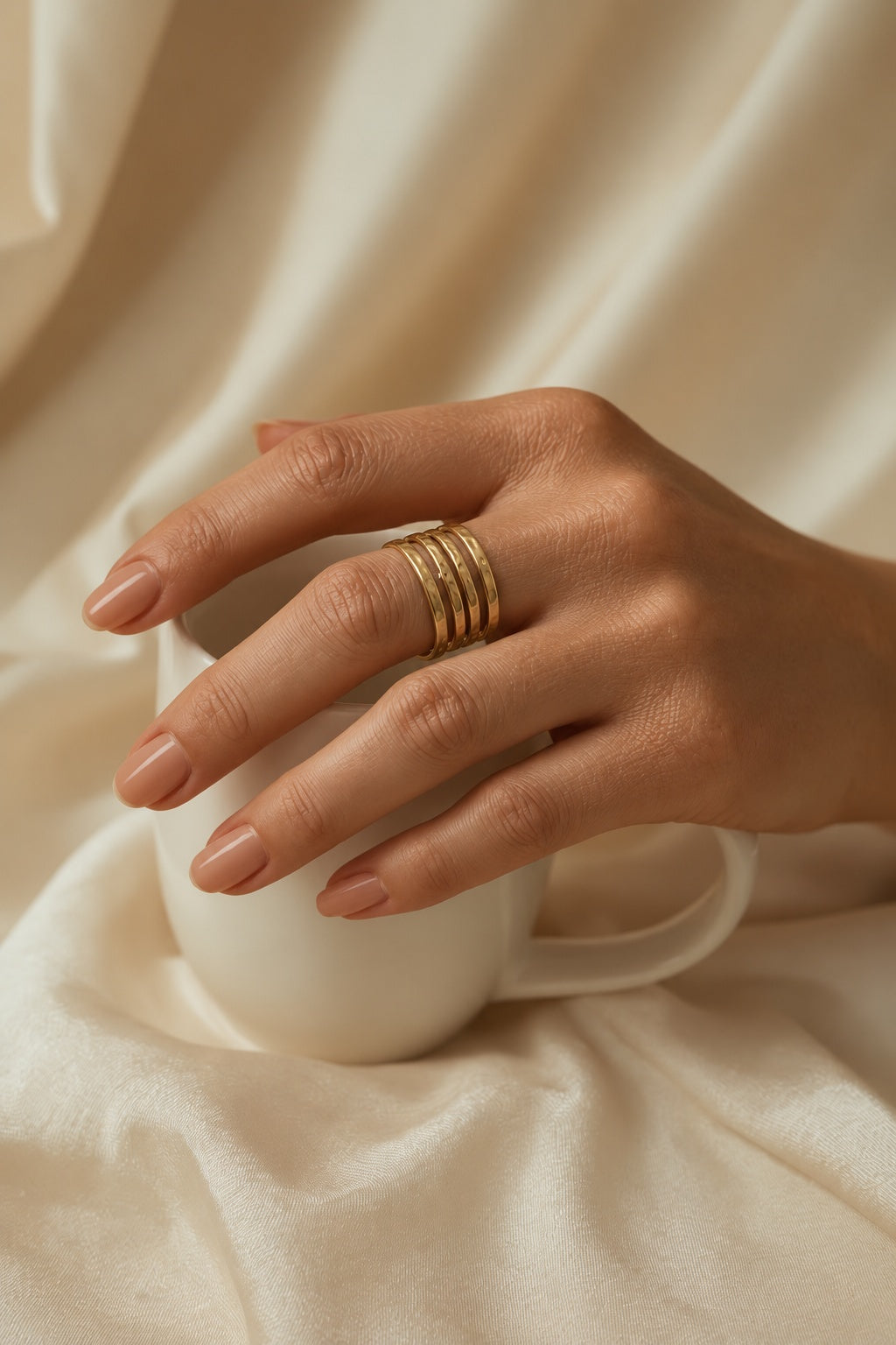 Niska hammered gold-tone four-band adjustable cuff ring worn on model's hand