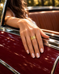 Niska gold-tone geometric wide band ring worn by a model