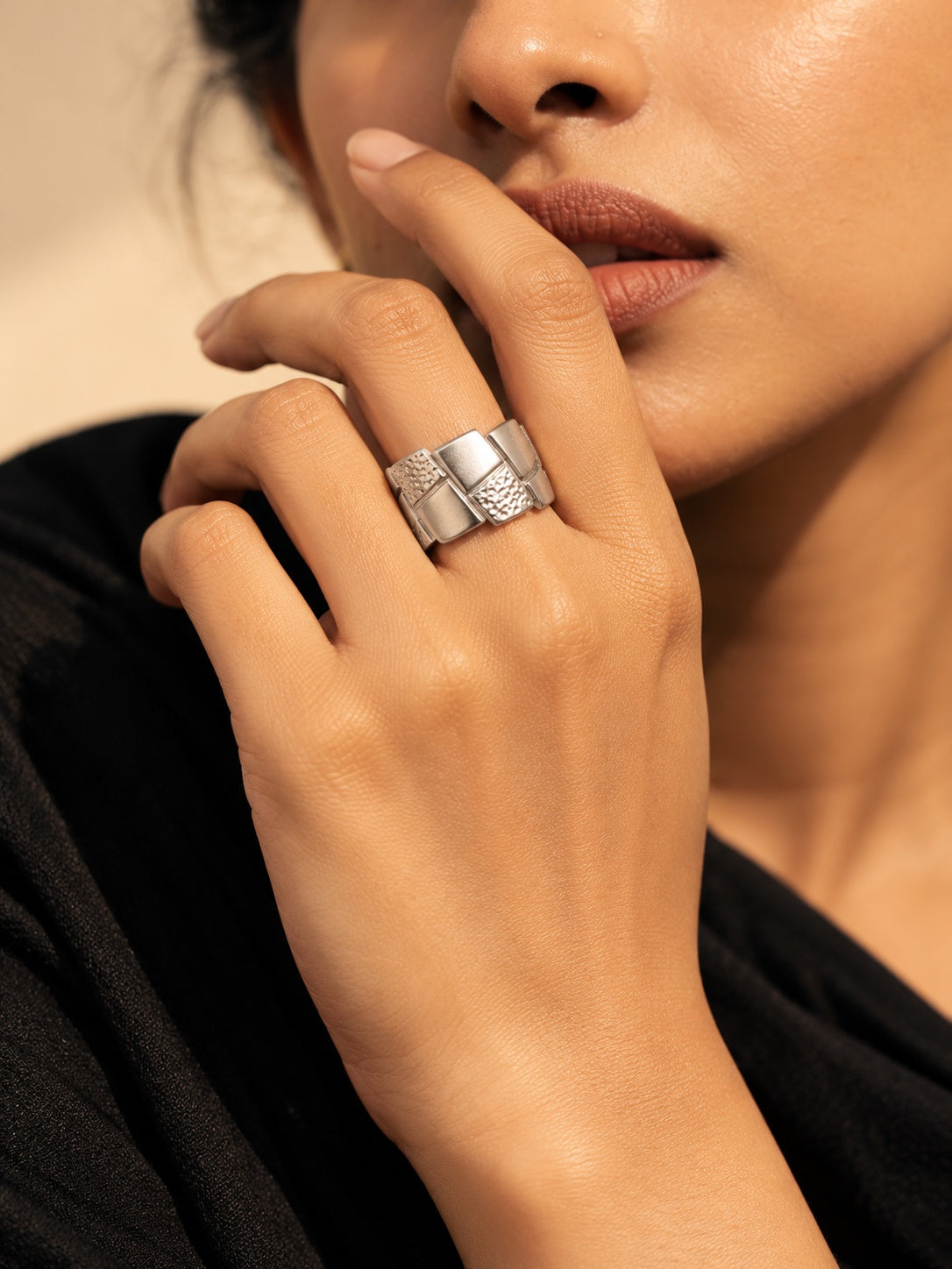Niska silver tone geometric replica ring worn on model hand