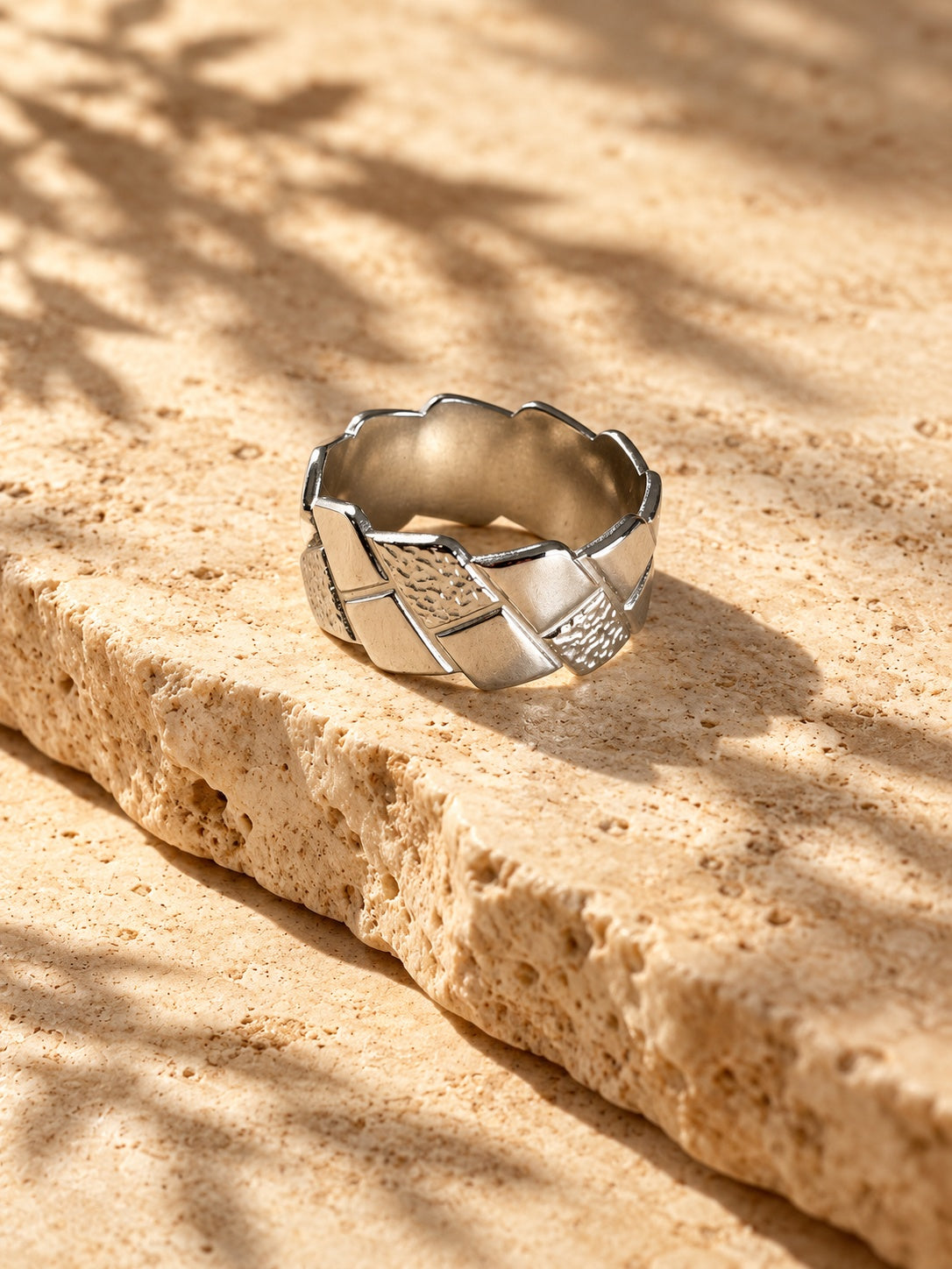Niska silver tone geometric replica ring worn on model hand